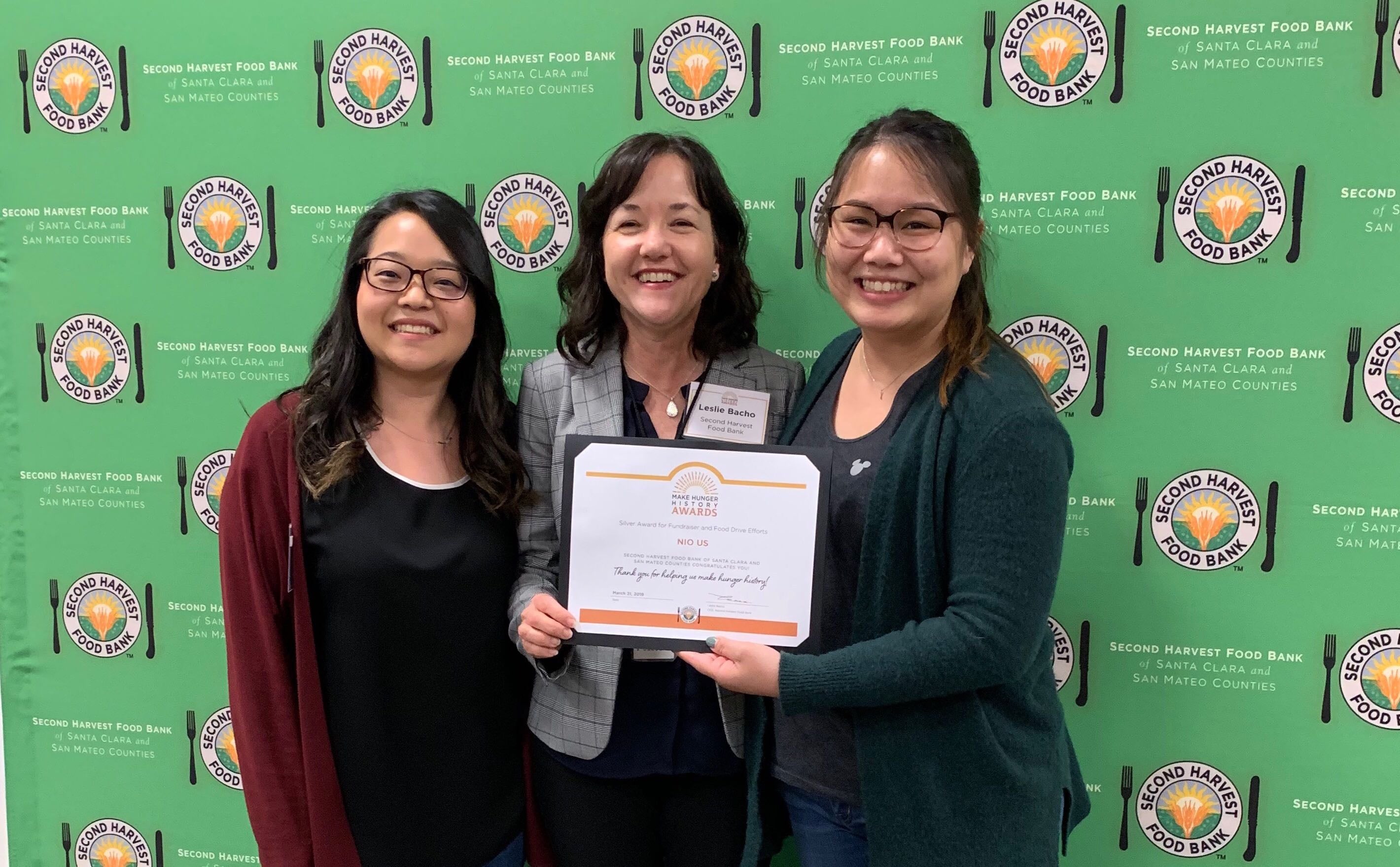 Taylor Kotake and Kristine Vu with Second Harvest’s CEO, Leslie Bacho